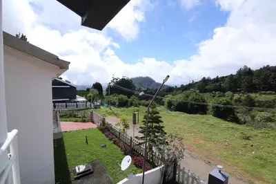 a view from the balcony of a house at Tiger Hill Homestay in Ooty