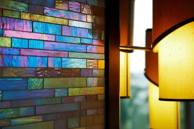 a brick wall with a colorful mosaic on it at Vivanta Coimbatore in Coimbatore