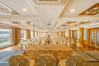 a large room with a long table and chairs at Sterling Ooty Elk Hill in Ooty