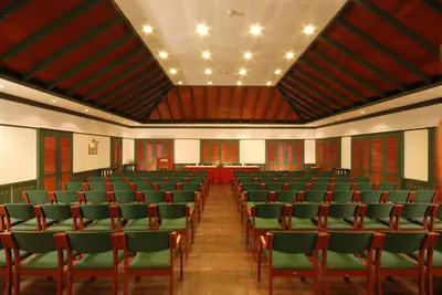 a large room with chairs and a table in it at The Raviz Kadavu, Kozhikode in Kozhikode