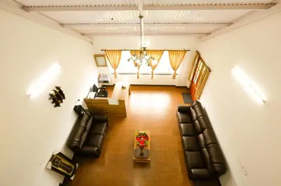 an overhead view of a living room with chairs and a table at Mystique stay resort in Kotagiri