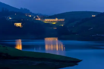 a view of a river at night at Destiny - The Farm Resort in Ooty