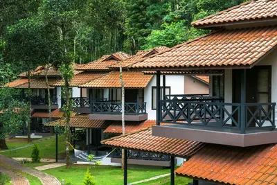 a building with red tile roofs and a balcony at The Serenity Resort in Tariyod