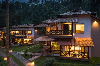 a view of a villa at night at The Serenity Resort in Tariyod