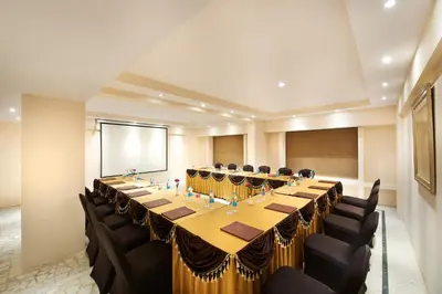 a large conference room with a long table and chairs at Accord Highland Hotel Ooty in Ooty