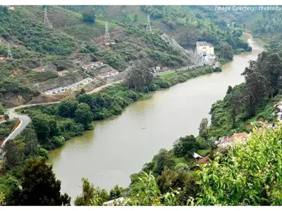 a view of a river from a hill with trees at The Views - True Baduaga Living in Ooty