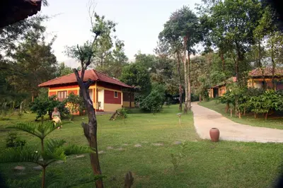 a person riding a horse in front of a house at Agraharam Resorts in Thirunelli