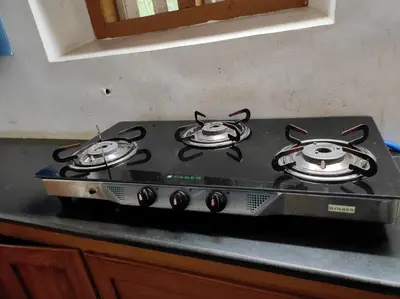 a stove top with two burners on top of it at Kunnampath Heritage Nalukettu in Trichūr