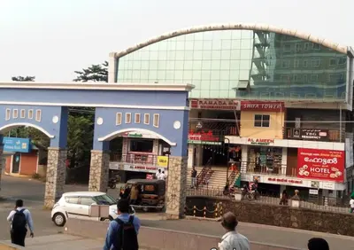 a group of people walking in front of a building at ALSHIFA TBG RESIDENCY in Perintalmanna