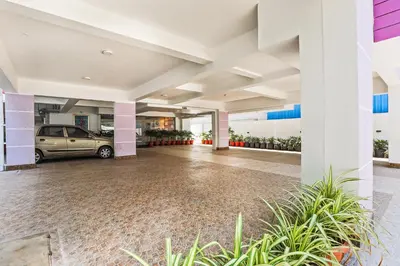 a large building with a car parked in it at Park Avenue Suites in Coimbatore