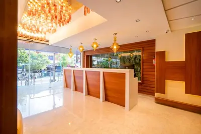 a lobby with a bar in a building at JK HOTELS in Coimbatore