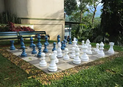 a giant chessboard is sitting in a yard at Indeevara Luxury Resort and Spa, Wayanad in Vythiri