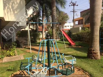 a playground with a slide in a park at Homestay for Women in Coimbatore