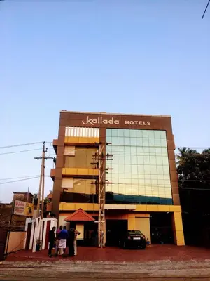 a building with people standing in front of it at Kallada Hotels and Resorts in Trichūr