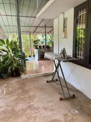 a room with a table in a room with plants at Gloria Homestay ,Thrissur - Pooram Bookings open Apr 25-27 in Trichūr