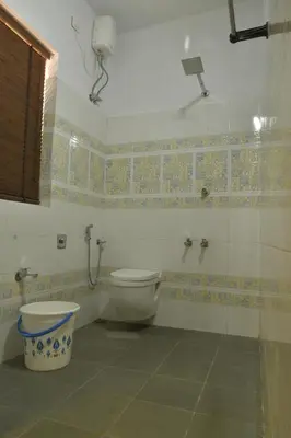 a bathroom with a toilet and a shower at Gloria Homestay ,Thrissur - Pooram Bookings open Apr 25-27 in Trichūr