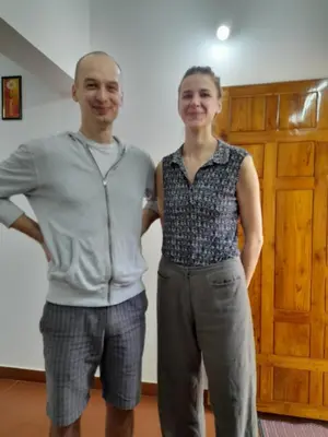 a man and a woman standing next to each other at Back Packers Cochin Villa in Cochin