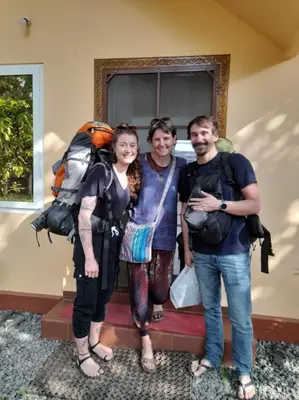 a group of three people posing for a picture at Back Packers Cochin Villa in Cochin