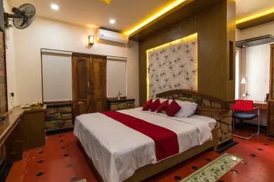 a bedroom with a large bed in a room at Olives The Boutique Resort in Kalpetta