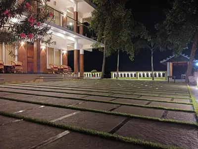 an empty courtyard at night with a building at SAGAR BEACH VILLAS Home stay in Cherai Beach