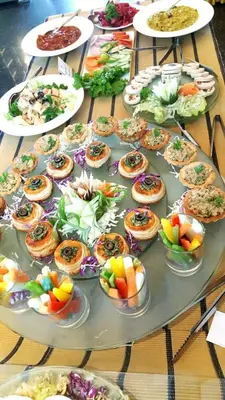 a table with many plates of food on it at Copper Folia in Kozhikode