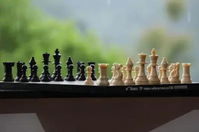 a chess board with chess pieces on a table at CONTOUR ISLAND RESORT & SPA , wayanad in Tariyod