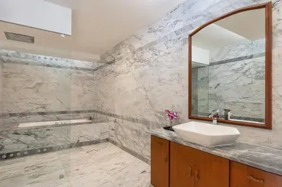 a bathroom with a sink and a mirror at Le Meridien Coimbatore in Coimbatore