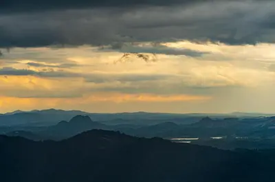 a view of the mountains under a cloudy sky at Zostel Plus Wayanad in Kalpetta