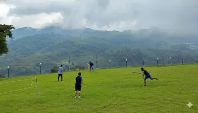 a group of people playing frisbee in a field at The Bowers Chalet Private Campfire & Lawn BBQ, WIFI, Breakfast Hill Top 360 degree view in Ooty