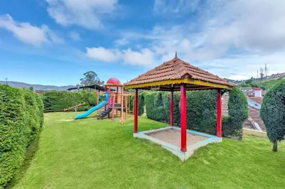 a playground with a gazebo and a slide at Club Mahindra Derby Green, Ooty in Ooty