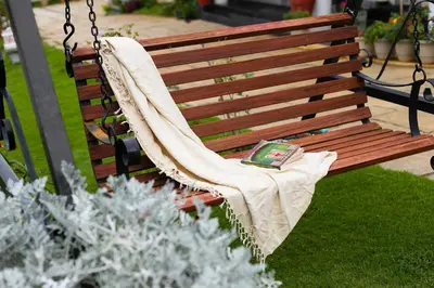 a book sitting on a bench in a park at StayVista at Aashirwaad Villa in Coonoor
