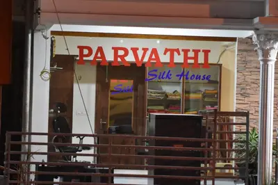 a paravalitz silk house sign in a store window at Heritage Inn in Mysore