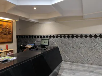 an office with a desk with a computer on it at Aashraya in Mysore