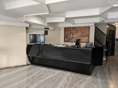 a reception desk in a room with at Aashraya in Mysore