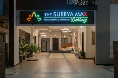 a lobby of a building with a sign that reads the sunaya max at THE SURRYA MAX RESIDENCY in Pollāchi