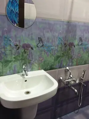 a bathroom with a sink and a mirror at Olive Inn Apartment in Alwaye