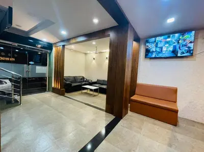 a living room with a couch and a table at KB RESIDENCY in Kozhikode