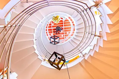 a spiral staircase on a cruise ship at Aishwarya Residency in Mysore