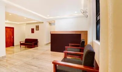 a meeting room with chairs and a blackboard at Treebo New Redfern, Madikeri in Madikeri
