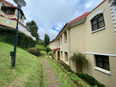 a street light sitting next to a building at Mountain Retreat - A Hill Country Resort in Ooty