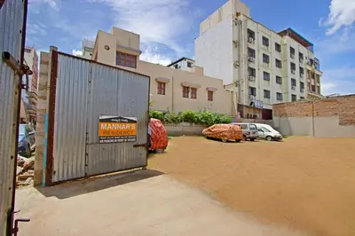 a gate with a sign on it in front of a building at Mannars Residency in Mysore