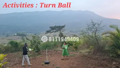 a man and a woman standing on a hill at Shining Caves Resort in Varagampadi
