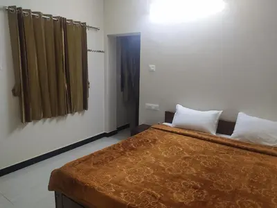 a bedroom with a large bed in a room at Heritage Holiday Home in Ooty