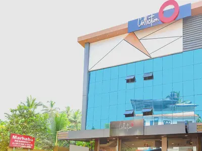 a building with a sign on the side of it at Collection O Marhaba Govindapuram in Calicut