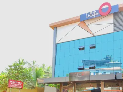 a building with a sign on the side of it at Collection O Marhaba Govindapuram in Calicut