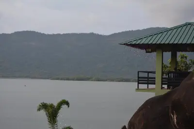 a gazebo with a view of a lake at Diga vista resorts in Palakkad
