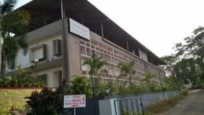 a building with a sign in front of it at KTDC Garden House in Palakkad