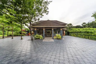 a house with a pavilion in the middle of a driveway at Sterling Govardhana Malampuzha in Palakkad