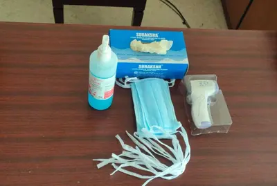 a table with a bottle of milk and a toothbrush at THE CASTELLO RESIDENCY in Coimbatore