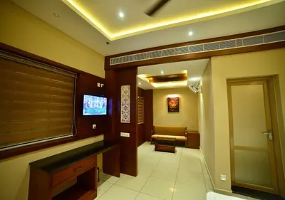 a hallway of a hospital with a waiting room at Hotel Priya in Kottakkal